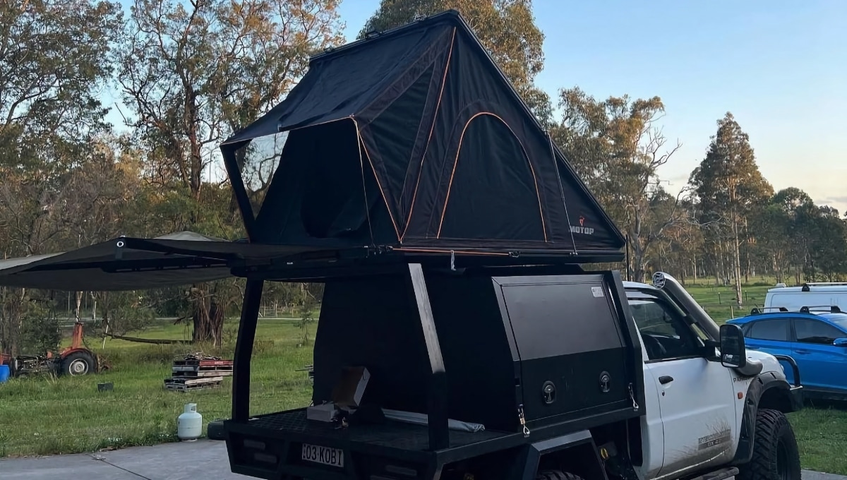 Camping equipment above the canopy. Tent installed on ute.